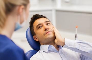 Man in dentist chair about to receive emergency dental care, Roseville NSW