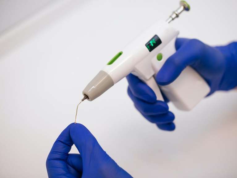 A person holding a rotary endodontic tool, Roseville NSW